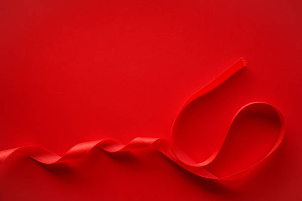 istock Red background with red satin ribbon frame, Valentine or Gift background 1584806665