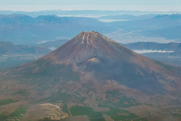 istock Mt. Fuji in clear autumn from the clear sky (above Shizuoka Prefecture) 1584808779