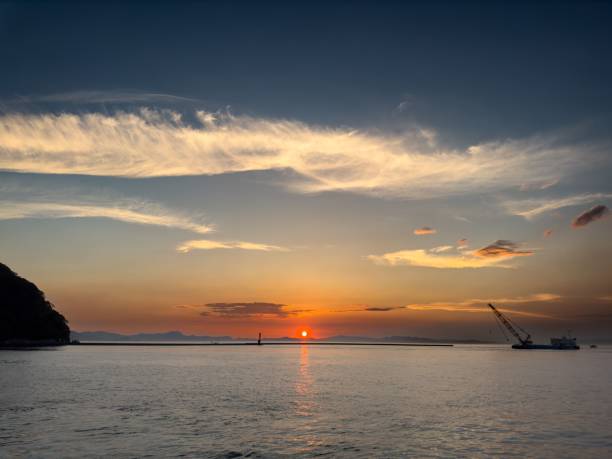 istock Stunning sunset in a tranquil bay in Japan 1584820858