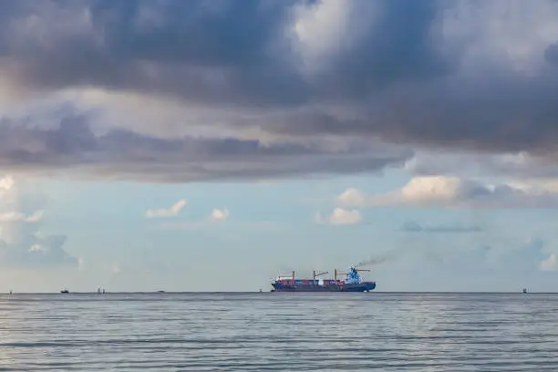 freight ship with container at the sea with cloudscape, Miami