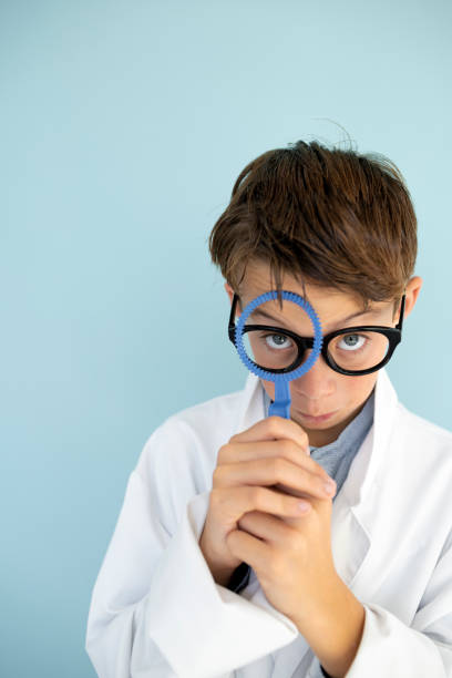istock young mad scientist with white coat and blue ring 1584863379