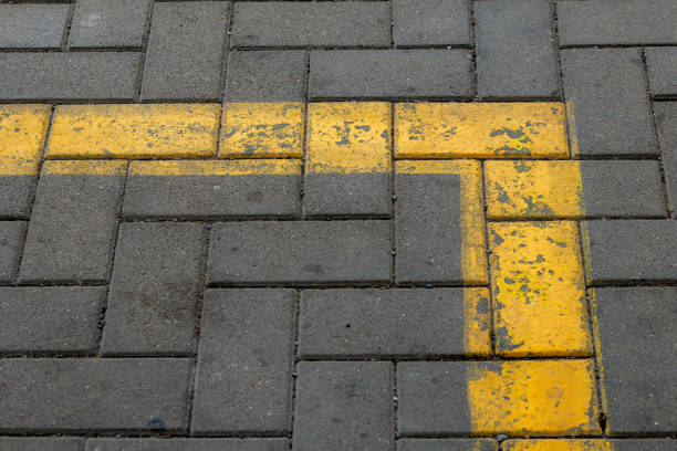 istock a yellow mark on paving stones 1584865973