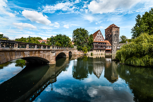 Reflections In Pegnitz River Between Karlsbücke And Hangman's Bridge In Nuremberg, Germany