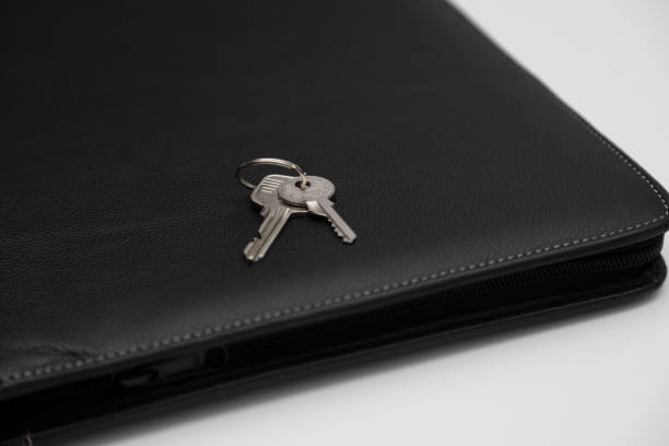 istock Coins, house keys, phone and folder with the house drawing on the table 1584936162