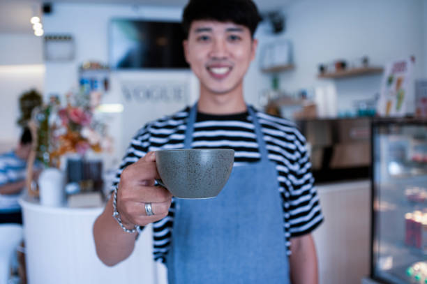 istock Barista serving coffee in a cafe, serving in a cafe. 1584941045