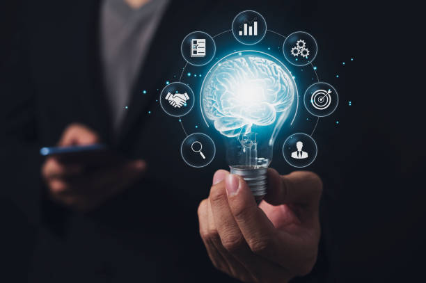 istock Businessman holding light bulb and brain inside, creativity and inspiration, idea and imagination. Scientific Innovation with Technological Innovation Network Analysis Solution Development 1584944968