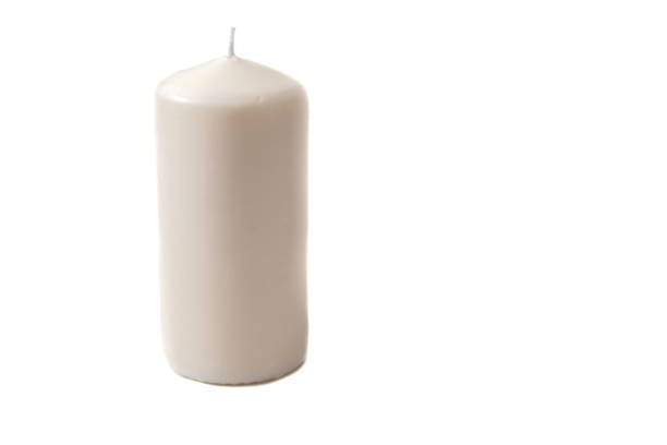 istock A brand new white candle. Isolated on a white background. 1584960680