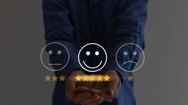 istock Hand touching and doing mark to select smiley face icon for evaluate product and service, customer satisfaction concept. 1585009086