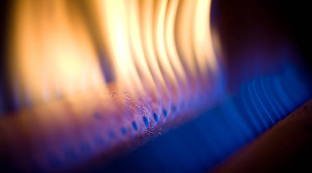 Orange and blue flames coming out of the gas torch Flame of a gas torch of a household heating copper propane photos stock pictures, royalty-free photos & images