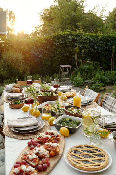istock Part of long table served with various food and snacks prepared for dinner 1585017313