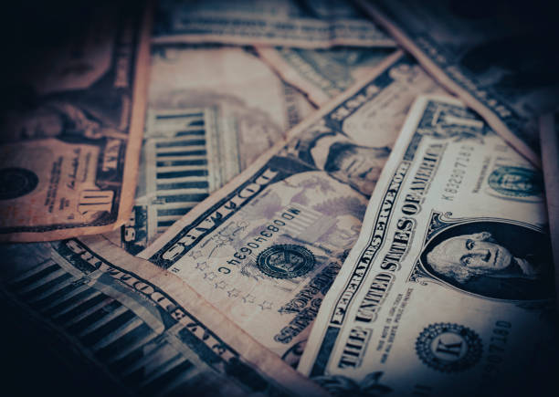 istock Money pile with different dollar bills 1585022788