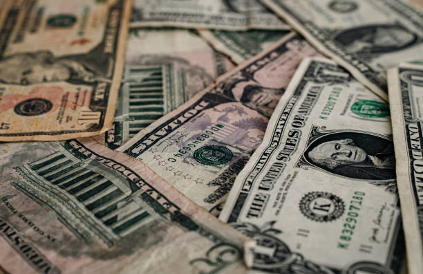 istock American dollar bills spread out in a heap 1585024396