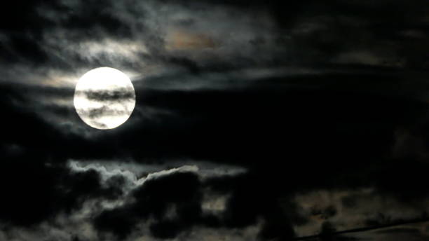 istock The full moon and clouds on a stormy night. Bavaria, Germany. 1585038473