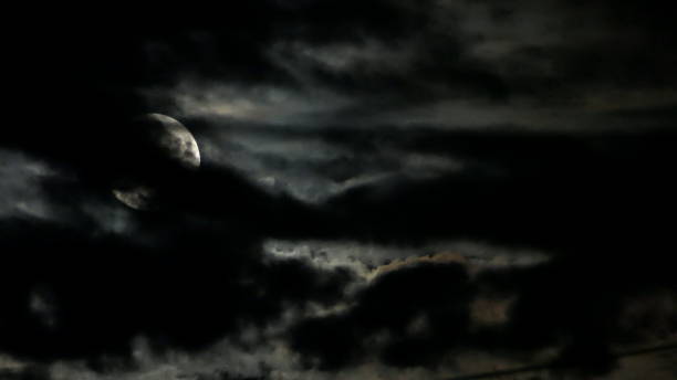 istock The full moon and clouds on a stormy night. Bavaria, Germany. 1585038482