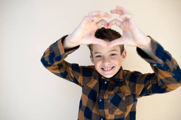 istock cool boy with checkered shirt against brown background 1585040106
