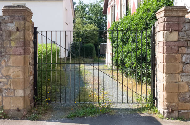 istock Old lattice gates at a farmhouse 1585045522