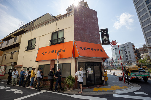 Tokyo, Japan - May 30, 2023 : People queuing at Marucho Soba Noodle Shop in Ogikubo, Suginami, Tokyo, Japan.
