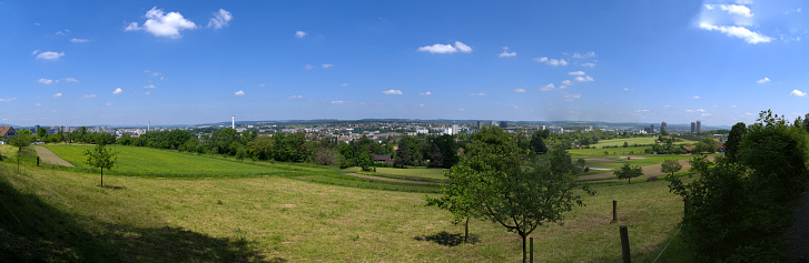 Wide angle landscape with Glatt Valley and skyline of City of Zürich North in the background on a sunny spring day. Photo taken May 26th, 2023, Zurich, Switzerland.