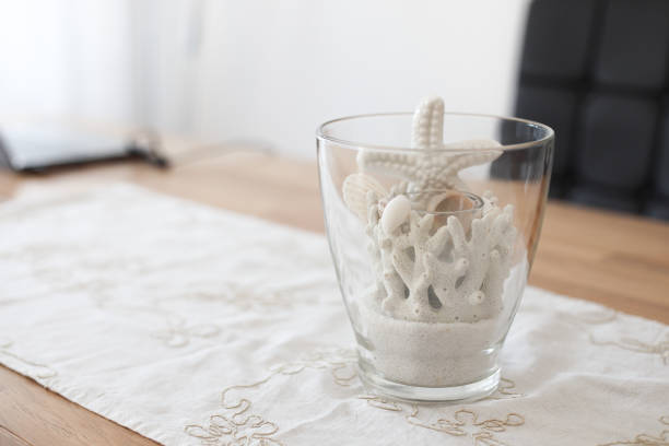 Starfish and corals in the glass on a blue background