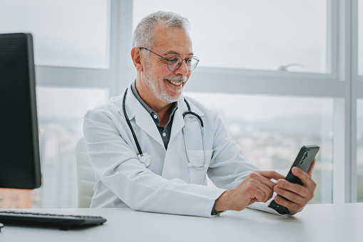 Portrait of a doctor using smartphone