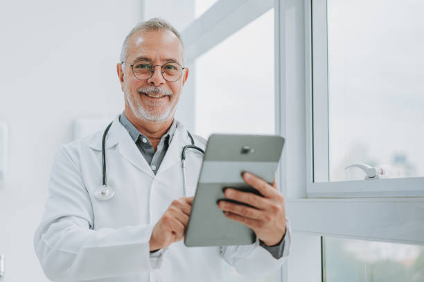 istock Portrait of a doctor using digital tablet looking at camera 1585067160