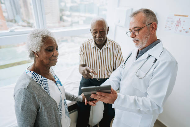 istock Patient at medical consultation, doctor using digital tablet 1585068770