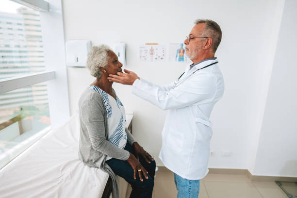 istock Patient with sore throat 1585069819