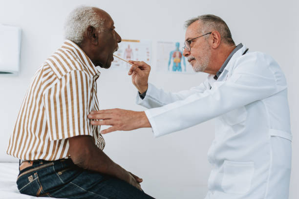 istock Patient with tongue stick sore throat 1585069829
