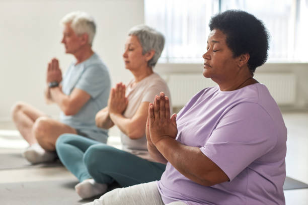 istock People meditating in lotus position 1585076445