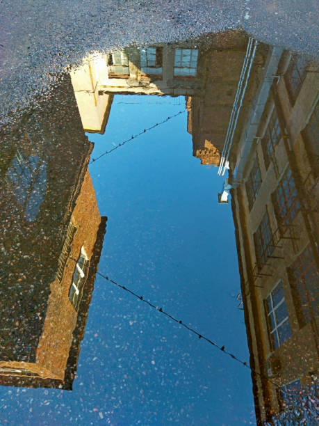 Reflection of building in wet wall