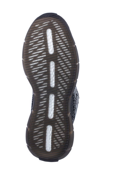 istock Black sole sneaker with gray touches on a white background. 1585128077