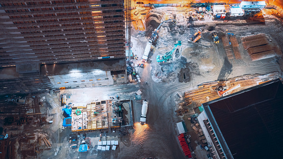 Nightwork Development Of Modern Multi-storey Residential Houses. Processing Of Metal Structures Building Skeleton. Freight Elevator Lifts Cargo. Timelapse Time Lapse Flat View Construction.