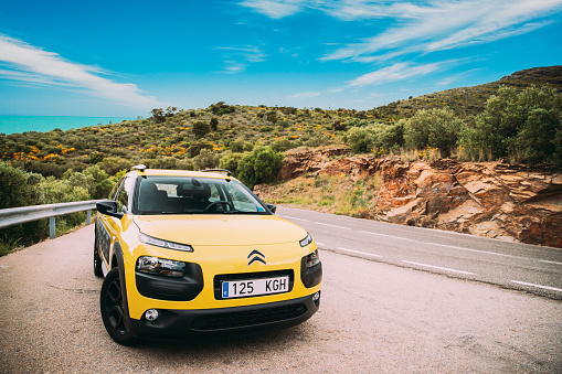 Catalonia, Spain - May 14, 2018: Citroen C4 Cactus Car Parked On Background Of Spanish Mountain Nature Landscape. The Citroen C4 Cactus Is A Mini Crossover, Produced By French Automaker Citroen