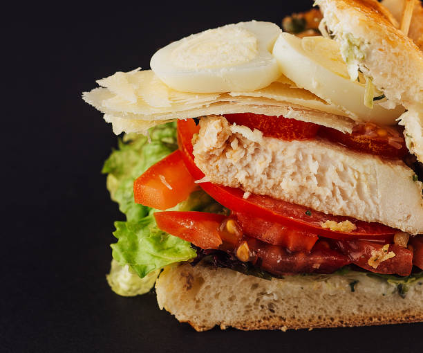 istock Chicken sandwich with boiled eggs, tomatoes and cheese 1585149338