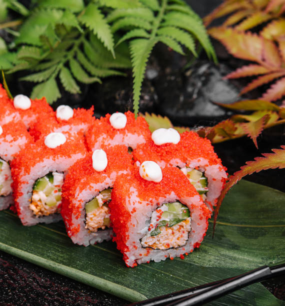 istock California Sushi roll cutting on a bamboo leaf 1585150085