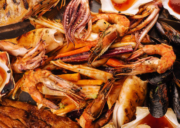 istock fresh shrimp, scampi, mussels, squid, octopus and scallops 1585151511