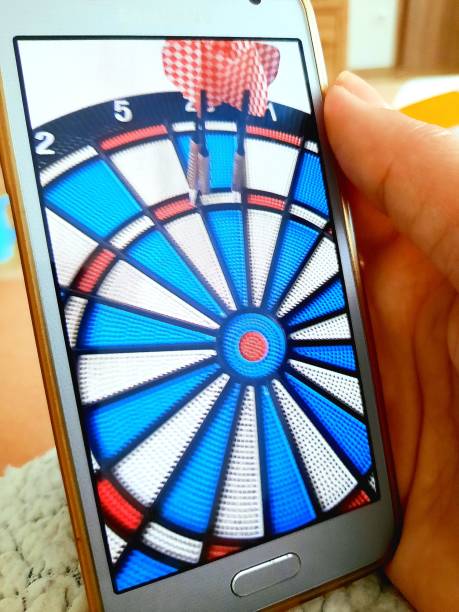 istock Close up - darts on a mobile phone's screen 1585154773