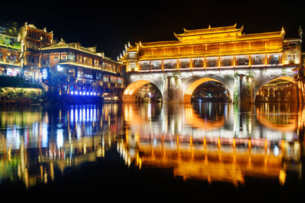 istock Night view of the Hong Bridge (Rainbow Bridge) in Fenghuang 1585156607