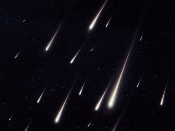 istock Meteor storm in the night sky. Meteorites and meteoroids. 1585163508