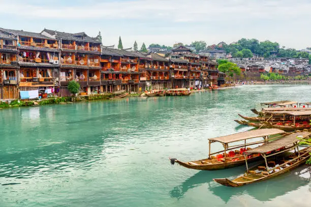 Awesome view of Phoenix Ancient Town (Fenghuang County) and the Tuojiang River (Tuo Jiang River) in China. Fenghuang is a popular tourist destination of Asia.