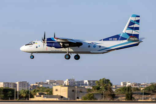 Luqa, Malta - July 31, 2023: Vulkan Air Antonov An-26B (REG: UR-CQD) on finals runway 31 in the evening.