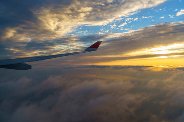 Airplane wing flying at sunset over Istanbul, Turkiye