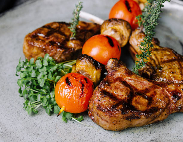istock Delicious grilled pork chop on plate 1585182939