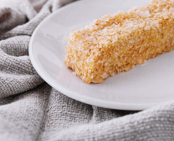 istock Piece of napoleon cake on a plate 1585183119