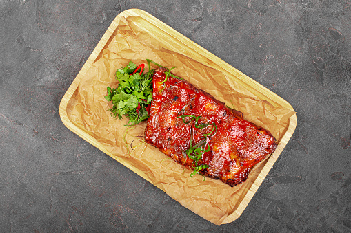 grilled pork ribs on a wooden board