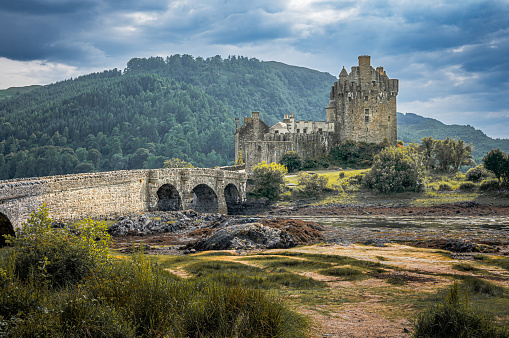 Dornie, Scotland - June 18, 2023: Eilean Donan Castle on Loch Duich is an iconic location in the Scottish Highlands.