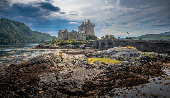 Dornie, Scotland - June 18, 2023: Eilean Donan Castle on Loch Duich is an iconic location in the Scottish Highlands.