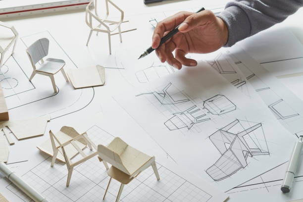 istock Designer sketching drawing design development product plan draft chair armchair Wingback Interior furniture prototype manufacturing production. designer studio concept . 1585234998
