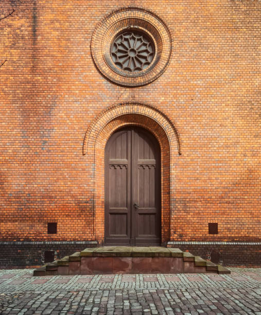 istock Side facade entrance into catholic church 1585240076