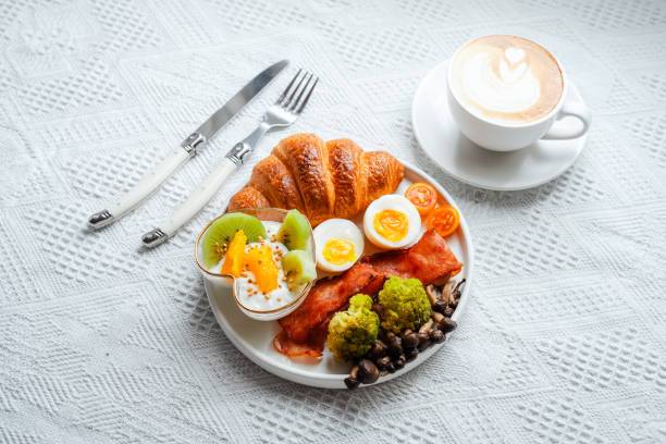 istock Breakfast croissants with yogurt, boiled eggs and bacon. 1585256944